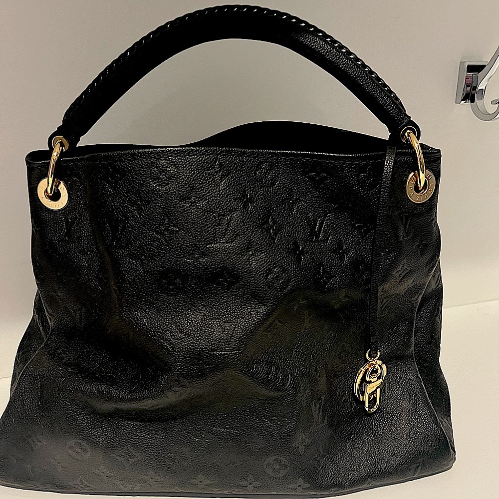 Louis Vuitton Artsy Leather handbag. Never used. Comes with box and dust cloth.